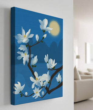White magnolia branch under moonlight with blue background