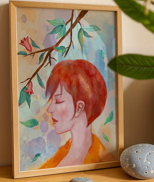 Illustrative artwork of a woman with red hair and floral branch