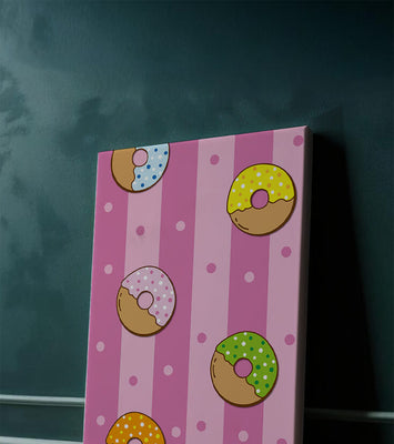 Colorful donut pattern on pink striped background