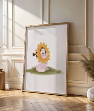 Adorable child with sunflower costume sitting on a grassy patch