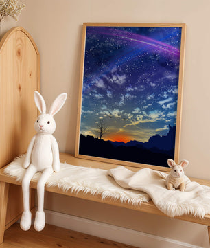 Starlit night sky with colorful sunset and silhouetted landscape