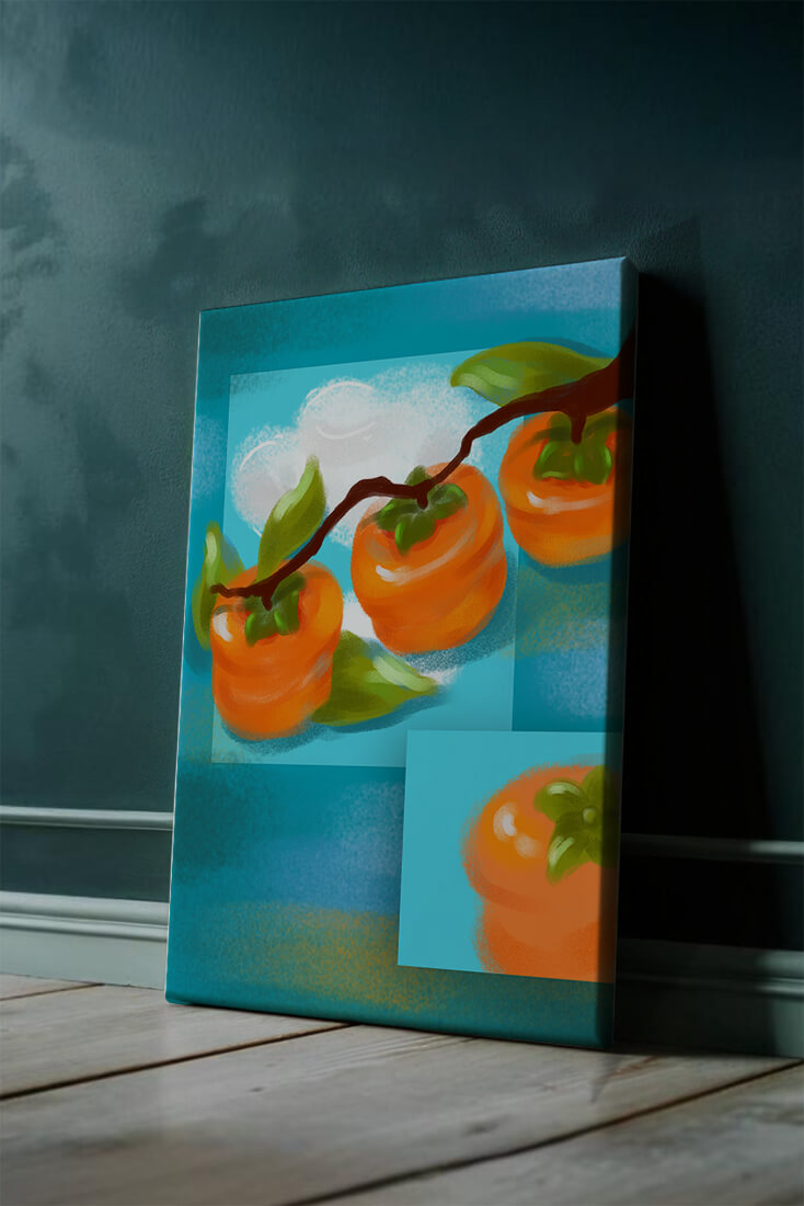 Vibrant persimmons on a branch with a blue background