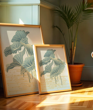 Elegant botanical illustration featuring large leaves with golden accents
