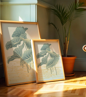 Elegant botanical illustration featuring large leaves with golden accents