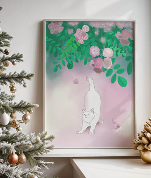 White cat stretching beneath blooming flowers in a pastel garden setting