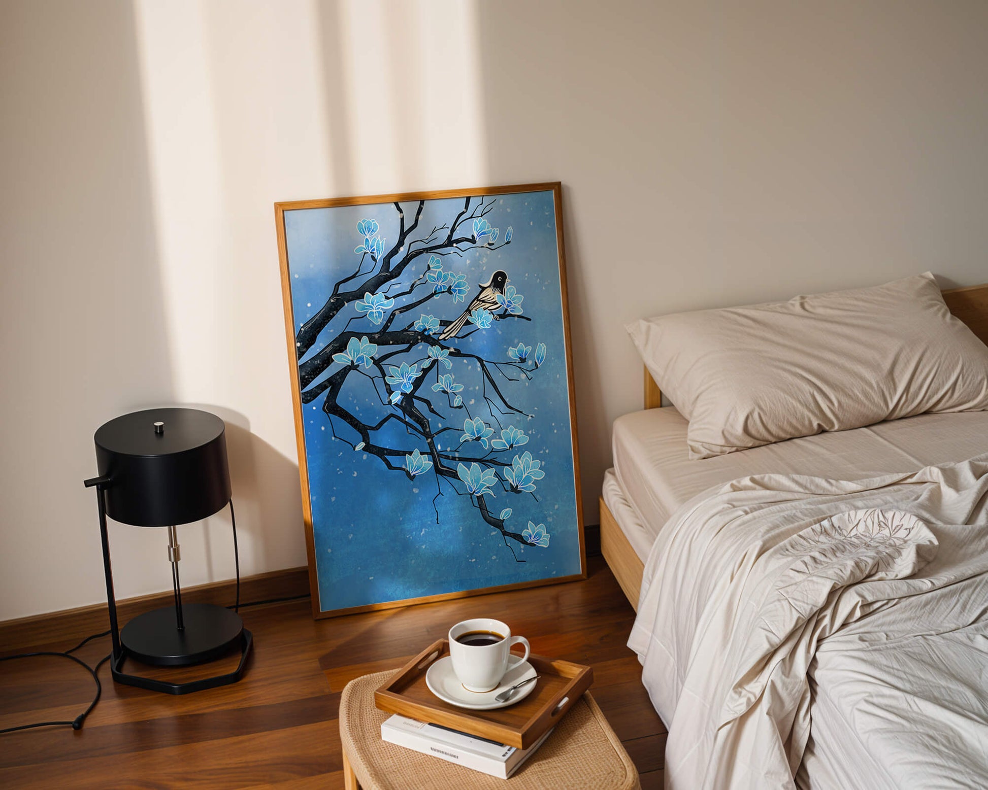 Bird on a branch with blue flowers against a snowy background