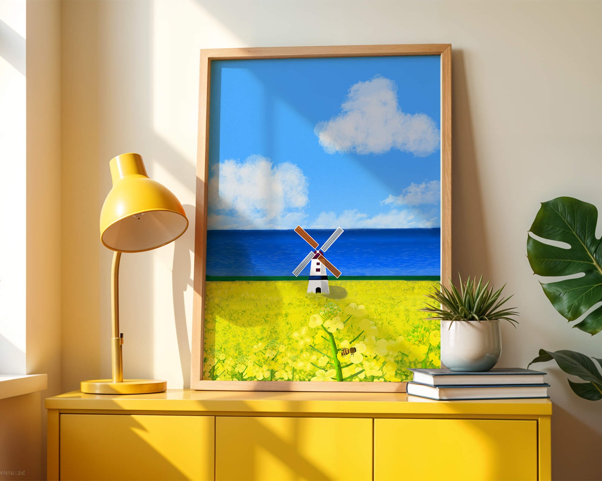 Scenic landscape with windmill in blooming field by the sea