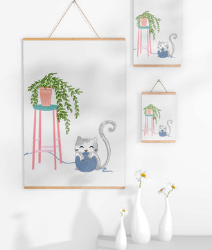 Cat Playing with Yarn Beside a Potted Plant on Pink Stool - Mi tienda