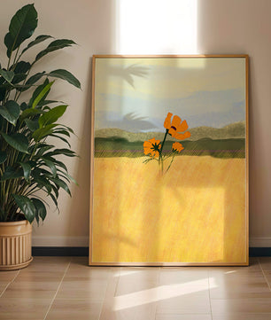 Orange Flowers in a Golden Field with Mountains and Blue Sky