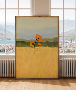 Orange Flowers in a Golden Field with Mountains and Blue Sky