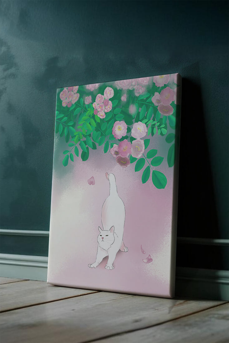 White cat stretching beneath blooming flowers in a pastel garden setting