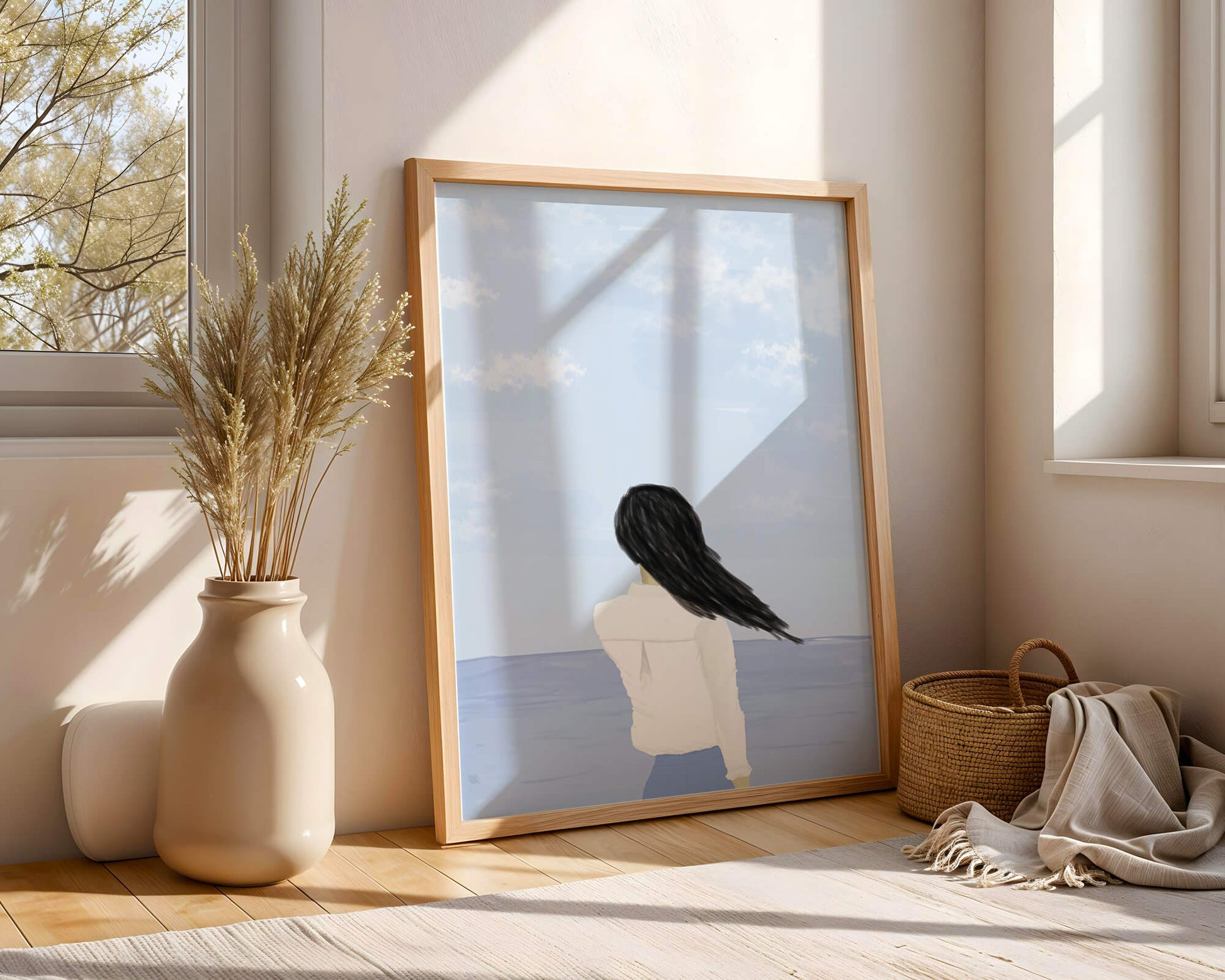 Woman gazing at the ocean with blue sky and clouds