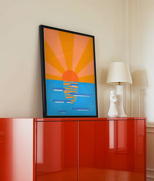 A vibrant sunrise illustration over the ocean with colorful rays