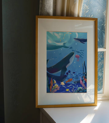 Underwater scene with whales, fish, and coral reef
